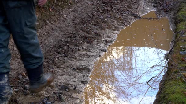 Man goes into the puddle mirror - Footage, Video