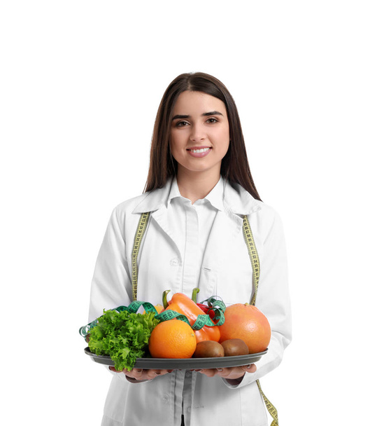 Portrait of female nutritionist with healthy products on white background - Photo, Image