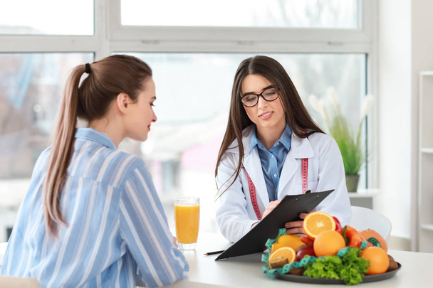 Young woman visiting nutritionist in weight loss clinic - Photo, Image