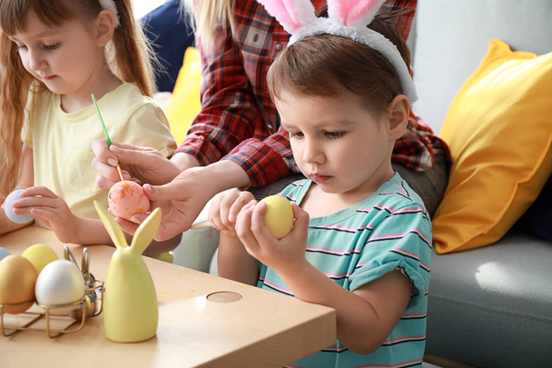 Cute little children painting Easter eggs at home - Fotografie, Obrázek