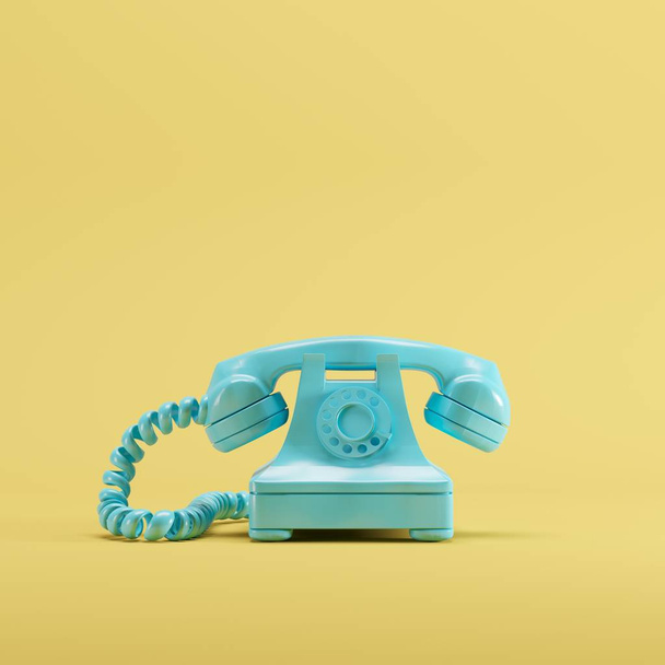 Blue vintage telephone on yellow pastel color background. minimal idea concept. - Photo, Image