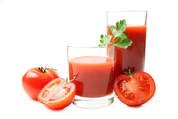 Lasi tuoretta tomaattimehua ja tomaatteja
 - Valokuva, kuva