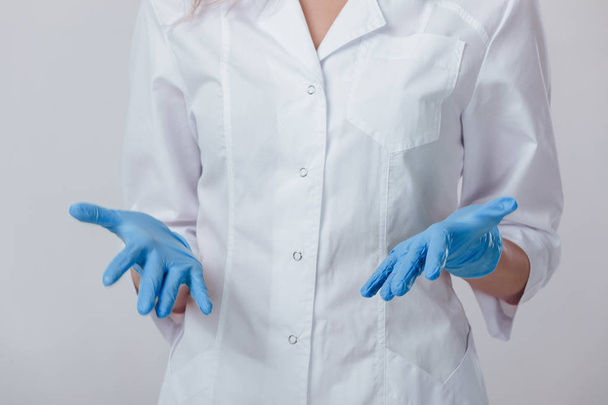 Woman doctor hands in medical latex blue gloves - Foto, Imagem