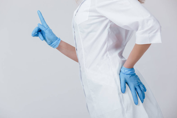 Woman doctor hands in medical latex blue gloves - Fotografie, Obrázek
