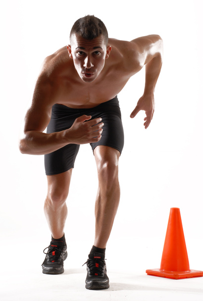 Healthy and fitness man running on white background. - Photo, Image