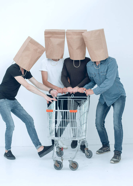 group of people with empty shopping carts. - Foto, Bild