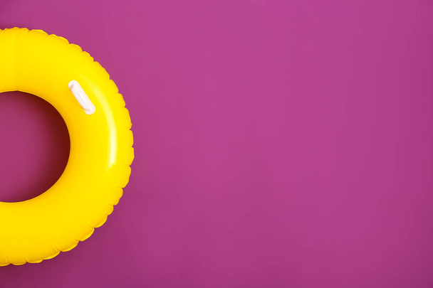 Bright inflatable ring on color background - Photo, Image