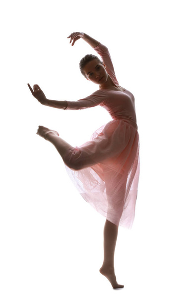 Silhouet van mooie jonge ballerina op witte achtergrond - Foto, afbeelding