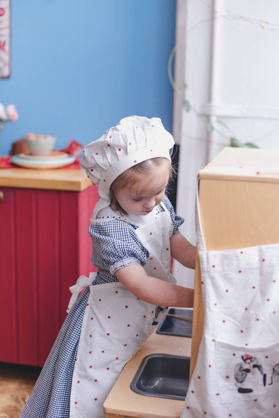 Little girl preparing food - Fotó, kép