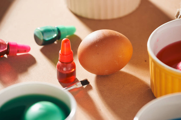 A dozen eggs in a carton, used watercolor paints.  - Foto, afbeelding