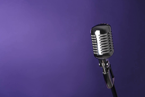 Retro microphone on color background - Photo, image
