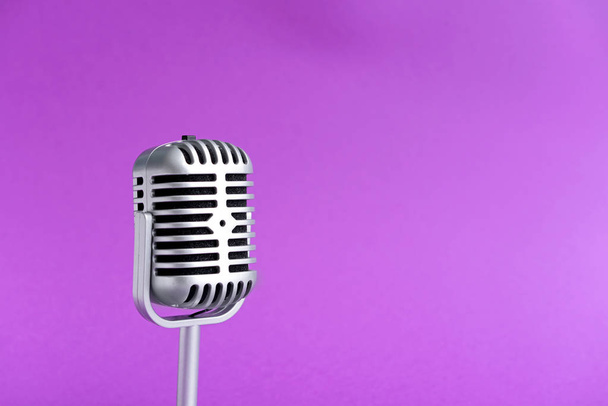 Retro microphone on color background - Fotó, kép