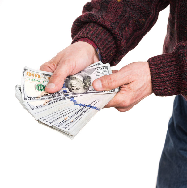 Hombre sosteniendo paquete de billetes de dólar
 - Foto, Imagen