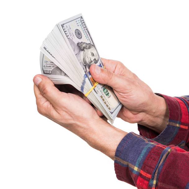 Homme tenant un paquet de billets de dollar
 - Photo, image