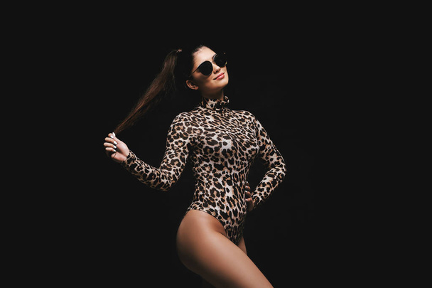 Alluring young brunette in leopard bodysuit - Φωτογραφία, εικόνα