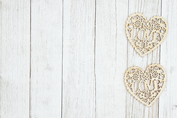 Wood hearts on weathered whitewash textured wood background - Photo, Image