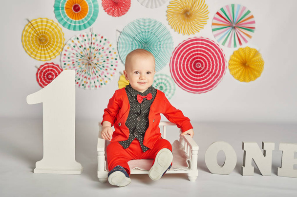 baby on a bright background in honor of the birthday - Photo, Image