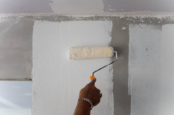 Painting color on building wall. Apartment renovation. - Photo, Image