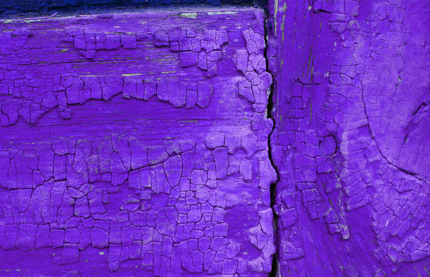 Vecchio sfondo in legno con resti di pezzi di scarti di vecchia vernice su legno. Texture di un vecchio albero, legno vintage sfondo vernice peeling. vecchio bordo blu con vernice incrinata - Foto, immagini