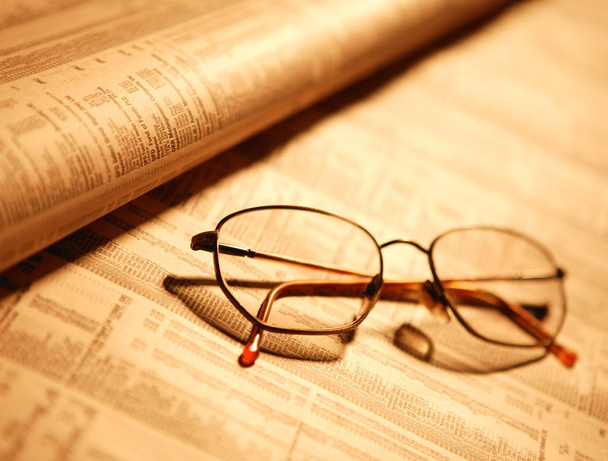 SPECTACLES ON FINANCIAL PAPER - Photo, Image