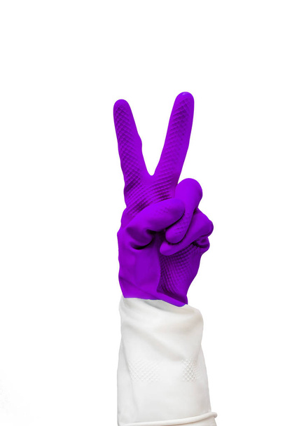 Close up of female hands in protective rubber gloves. everything is cool sign, two fingers, rabbit symbol. Healthy lifestyle - Zdjęcie, obraz