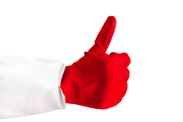 Close-up weergave hand dragen van een rubberen handschoen is opgevend duim van één hand maken als gebaar. Als teken van succes of goedkeuring geïsoleerd op een witte achtergrond. Horizontale kleurenfotografie. Meld u als - Foto, afbeelding