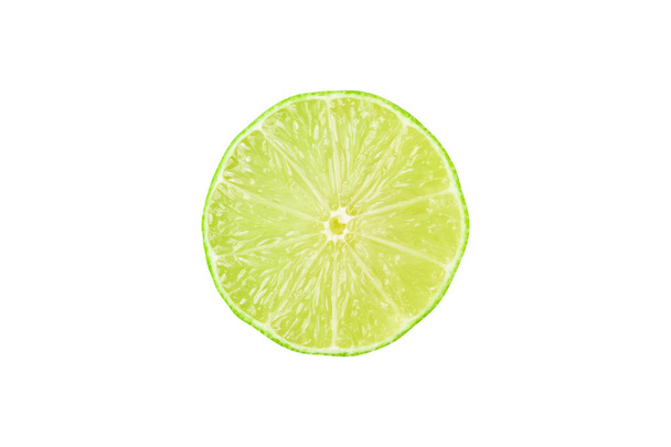 Half a ripe sliced lime. - Фото, зображення