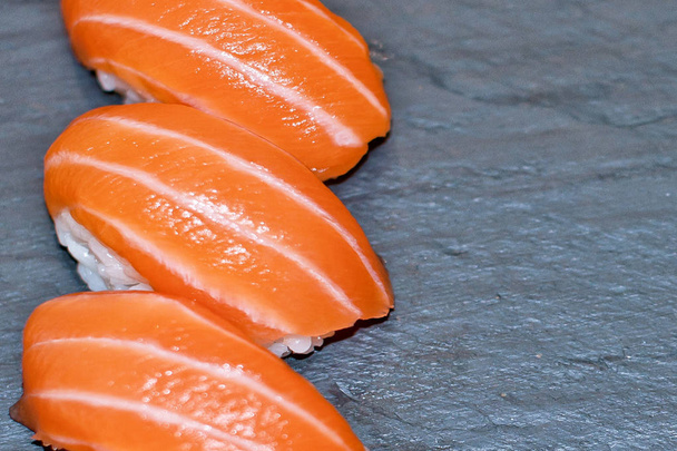 Rainbow Sushi Roll with salmon, eel, tuna, avocado, royal prawn, cream cheese Philadelphia, caviar tobica, chuka. Sushi menu. Japanese food. - Photo, image