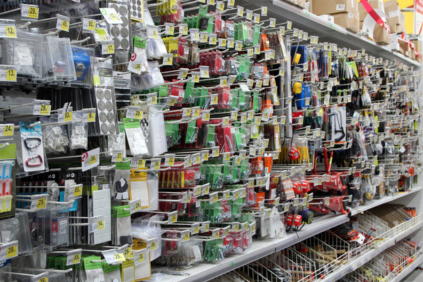 Household goods stickers, bolts, tapes measure are sold in supermarket - Photo, Image