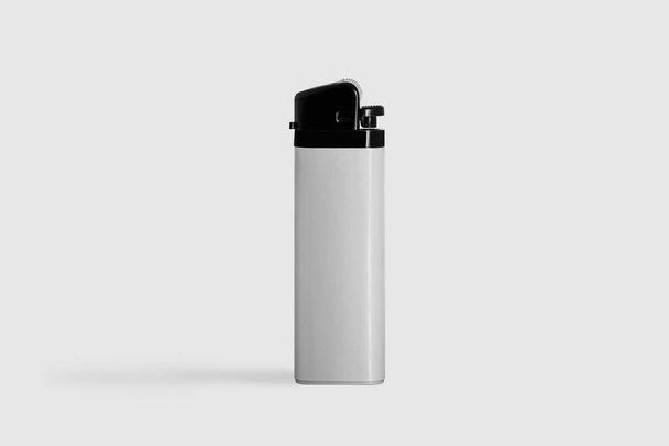 Plastic Gas Lighter. Gas lighter isolated on a soft gray background.Closeup shot, top view - Photo, Image
