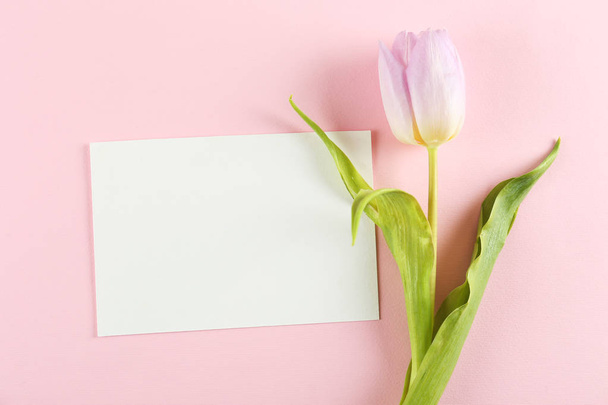 Floral composition with greeting card. - Φωτογραφία, εικόνα
