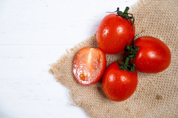 Fresh cherry tomatoes on a white wood background. - Foto, Imagem