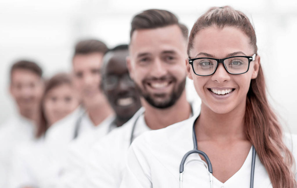 Team of smiling professional doctors standing together - Fotoğraf, Görsel