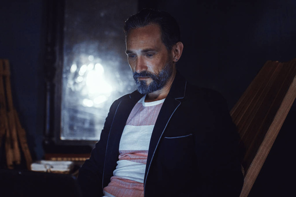 A Bearded Man Freelancer in a Black Jacket With a Beautiful Appearance. - Valokuva, kuva