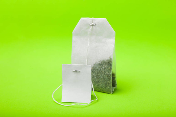 A white bag of green tea. - Valokuva, kuva