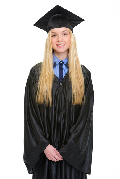 Portrait of happy young woman in graduation gown - Фото, изображение