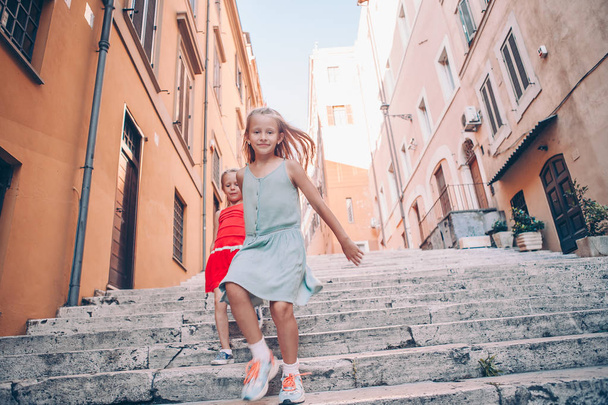 Adorable fashion little girls outdoors in European city - Photo, Image