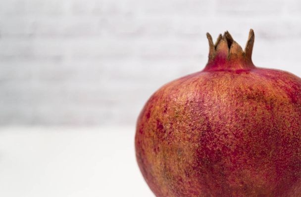 ripe pomegranate isolated on white background - Фото, зображення
