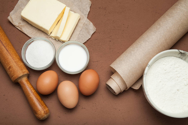 Cooking ingredients for dough and pastry, eggs, flour and butter - Fotografie, Obrázek