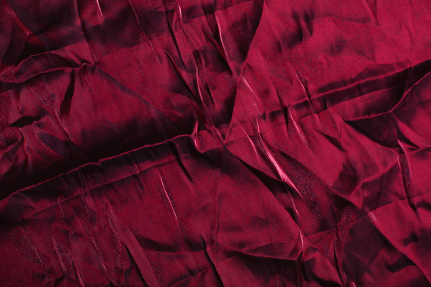 Textur, Hintergrund, Muster. zerknüllte Seide oder Satintuch dunkelrote Farbe - Foto, Bild
