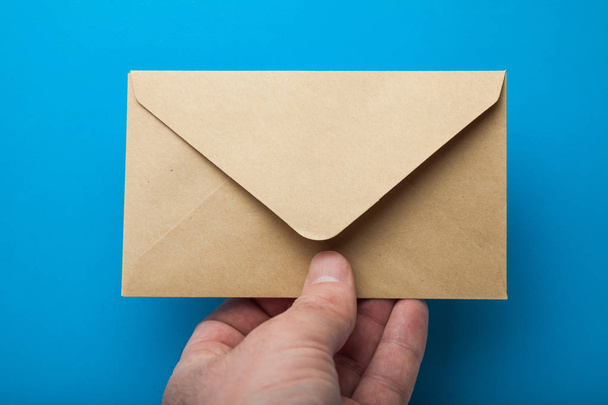 Blank recycled Envelope Mockup in hand. - Φωτογραφία, εικόνα