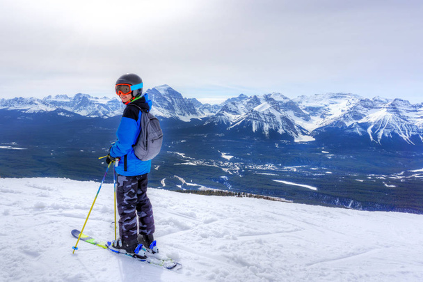 Young Skier on Mountain Edge at Lake Louise in the Canadian Rock - Photo, Image