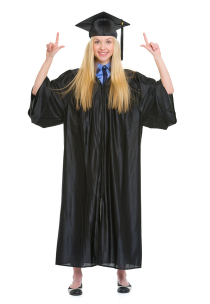 Full length portrait of happy young woman in graduation gown poi - Φωτογραφία, εικόνα