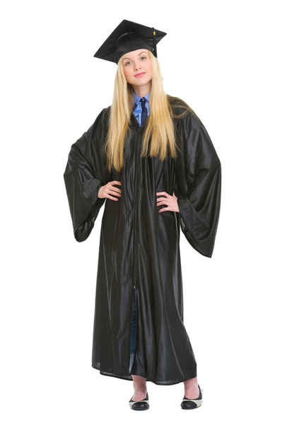 Full length portrait of happy young woman in graduation gown - Φωτογραφία, εικόνα