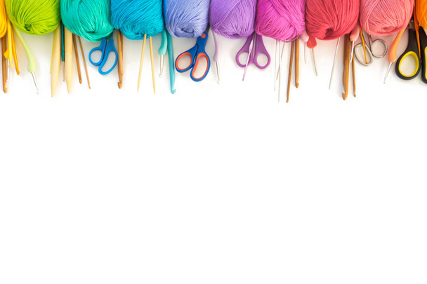 Colorful rainbow yarn for knitting. Hooks, scissors and knitting needles. - Φωτογραφία, εικόνα