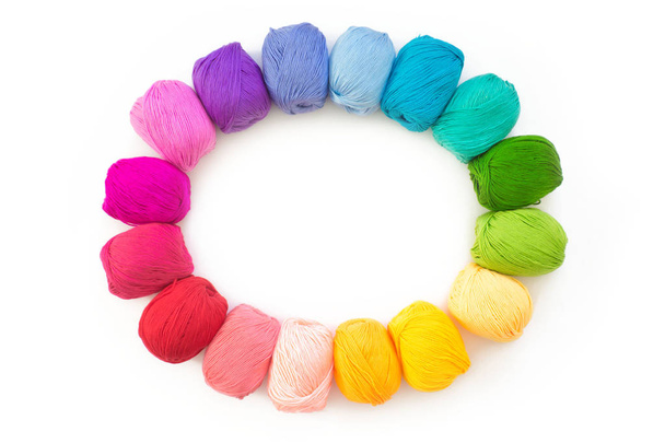 Colorful rainbow yarn for knitting. Hooks, scissors and knitting needles. - 写真・画像
