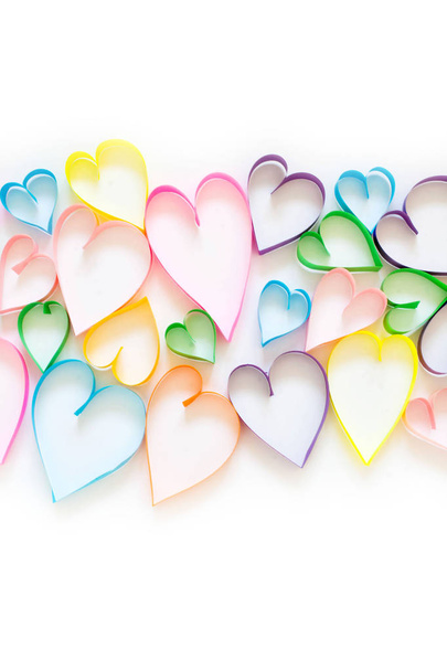 Bright colored hearts made of paper. White background. - Φωτογραφία, εικόνα