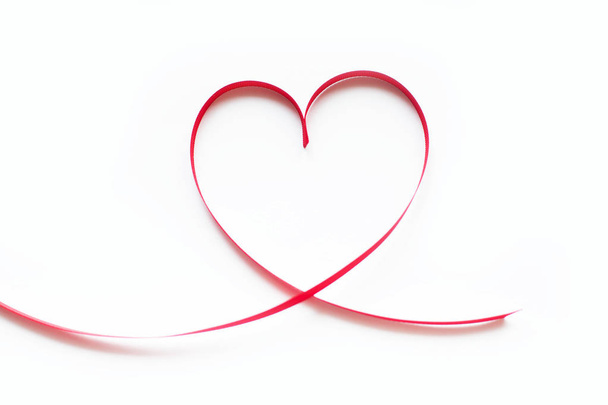 Valentines day card - heart made of ribbon on white background - Фото, изображение