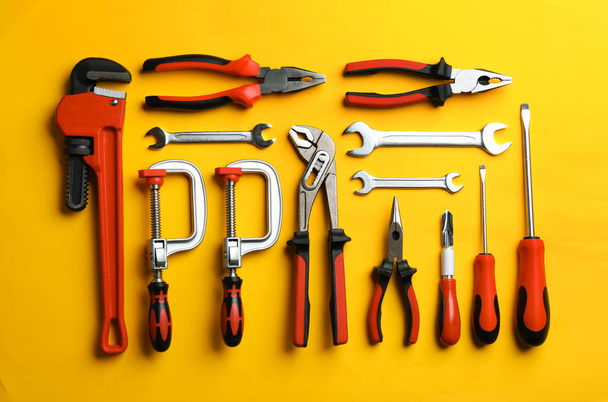 Flat lay composition with construction tools on color background - Photo, Image