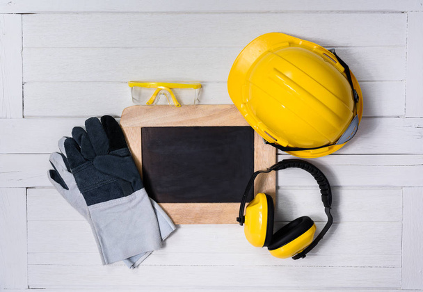 Standard construction safety equipment on wooden table. top view - Photo, Image